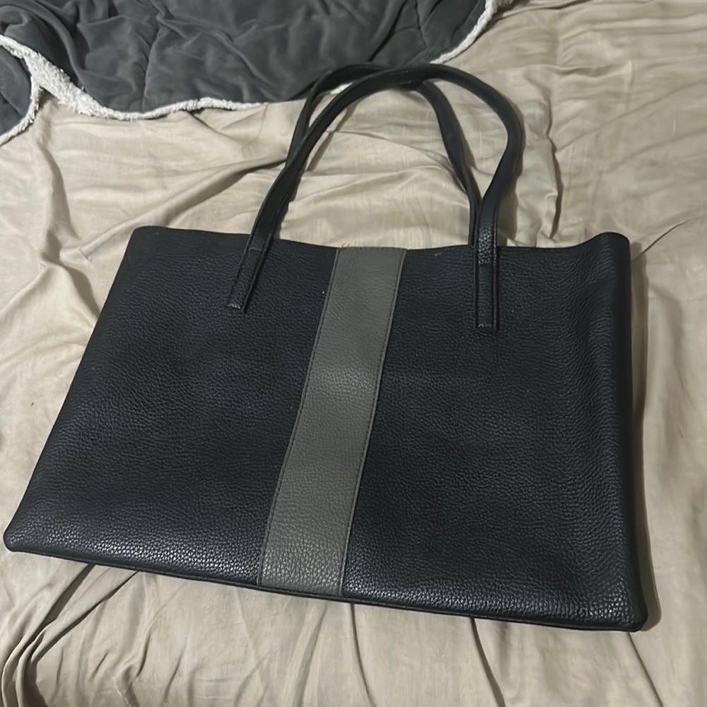Black leather computer bag or book bag.